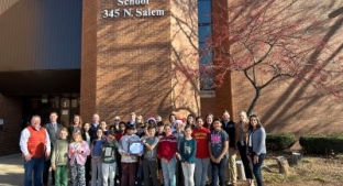 Tate & Lyle Employees with students outside Enders-salk school